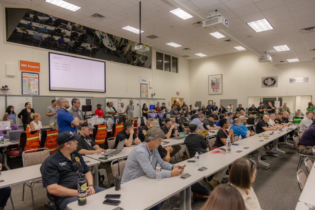 Participants in rows of tables at CACN event