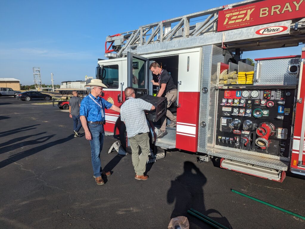 CACN researchers unloading equipment from fire truck